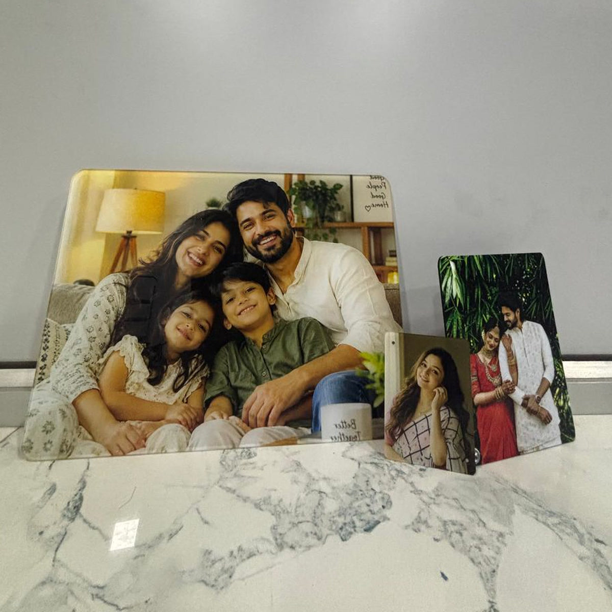 All three pieces of the photo gift combo — A3 acrylic frame, A5 MDF photo stand and acrylic fridge magnet