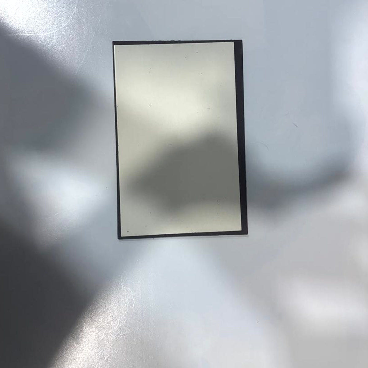 Back of the A3 acrylic frame showing the strong wall magnet — no nails or drilling needed