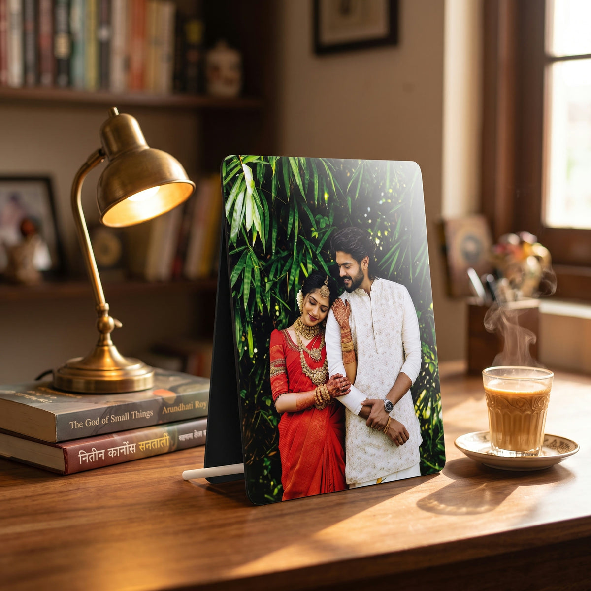 A5 UV printed MDF photo stand on a desk beside books and a cup of chai