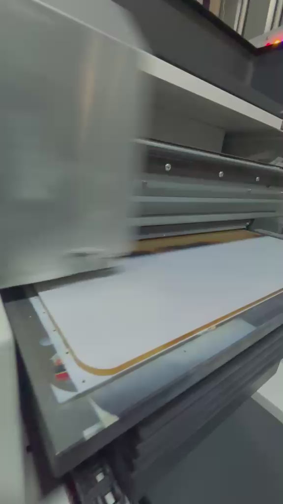 The A3 acrylic panel being UV printed