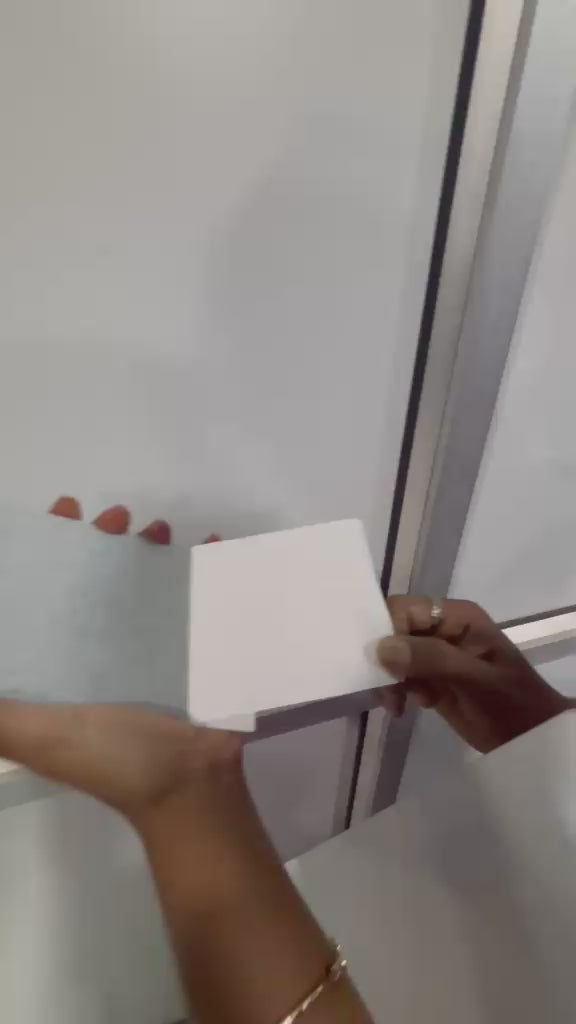 Mounting the A3 acrylic photo frame on a wall with its magnet